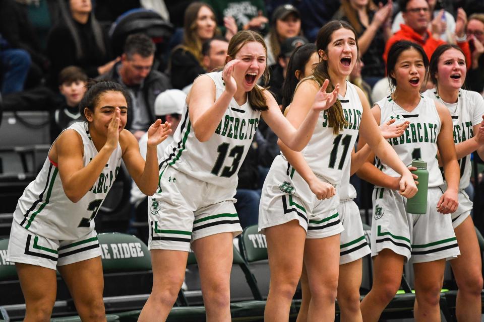 Fossil Ridge players celebrate after a SaberCats bucket in a girls high school basketball game against Fort Collins at Fossil Ridge High School on Tuesday.