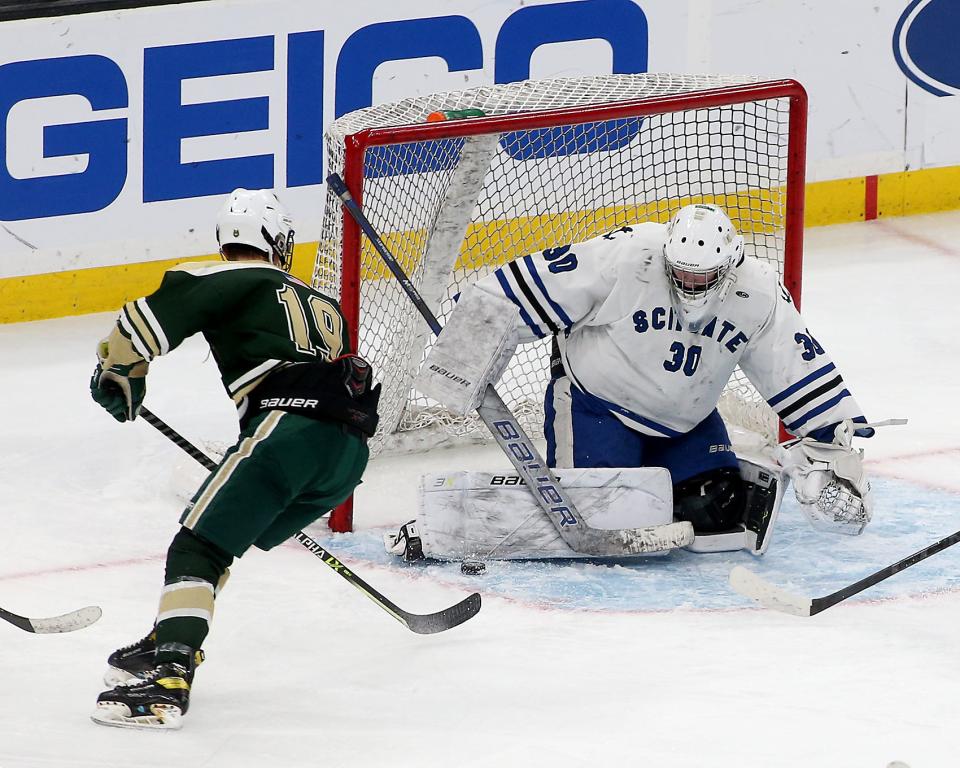 Scituate goalie Thomas McMellen makes a save on Nashoba Regional's Joe Quinn in the Division 3 state title game at the TD Garden on Sunday, March 19, 2023. Scituate fell to Nashoba Regional, 2-1 in OT.