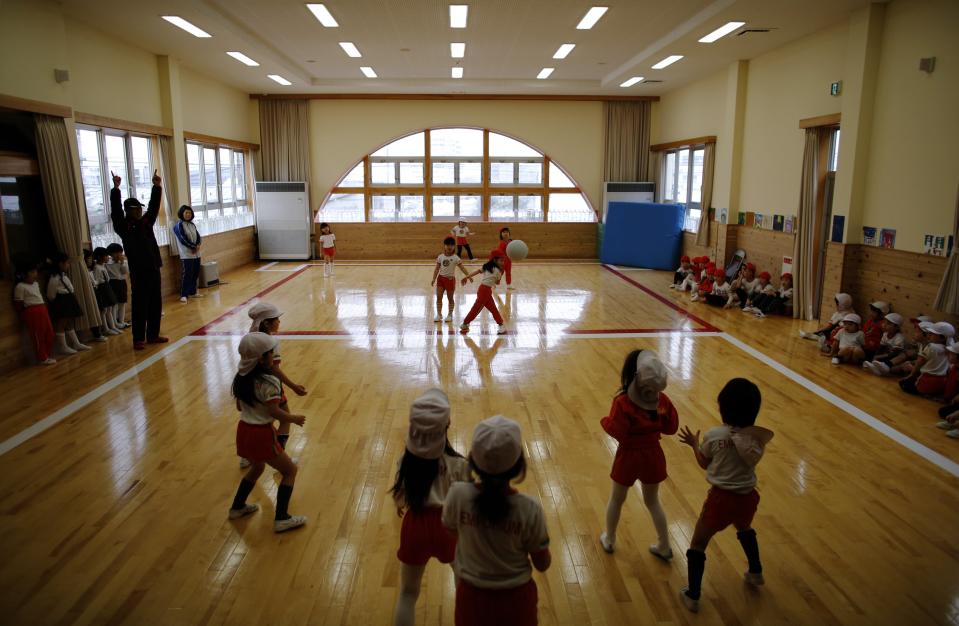 Children play dodge ball in a playroom at the Emporium kindergarten in Koriyama, west of the tsunami-crippled Fukushima Daiichi nuclear power plant, Fukushima prefecture February 28, 2014. (REUTERS/Toru Hanai)