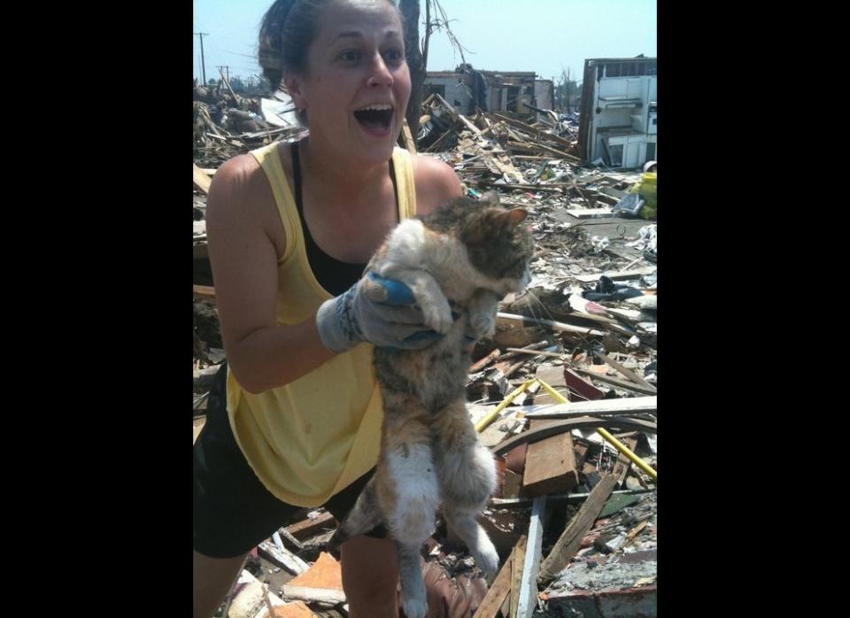 For 16 days, Lavern, a 13-year-old cat, was buried beneath the rubble of a house in Joplin, Mo. Her owner, Terrla Cruse, assumed her cat had died. But when she and her sister returned to the house to look for some papers, they heard meowing and began to dig frantically. Lavern's head soon emerged and Terrla's sister was quick to take a photo of the moment.