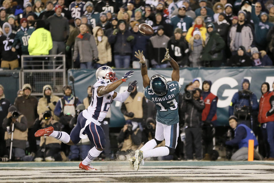 Philadelphia Eagles' Nelson Agholor (13) cannot catch a pass in the end zone against New England Patriots' J.C. Jackson (27) during the second half of an NFL football game, Sunday, Nov. 17, 2019, in Philadelphia. (AP Photo/Michael Perez)