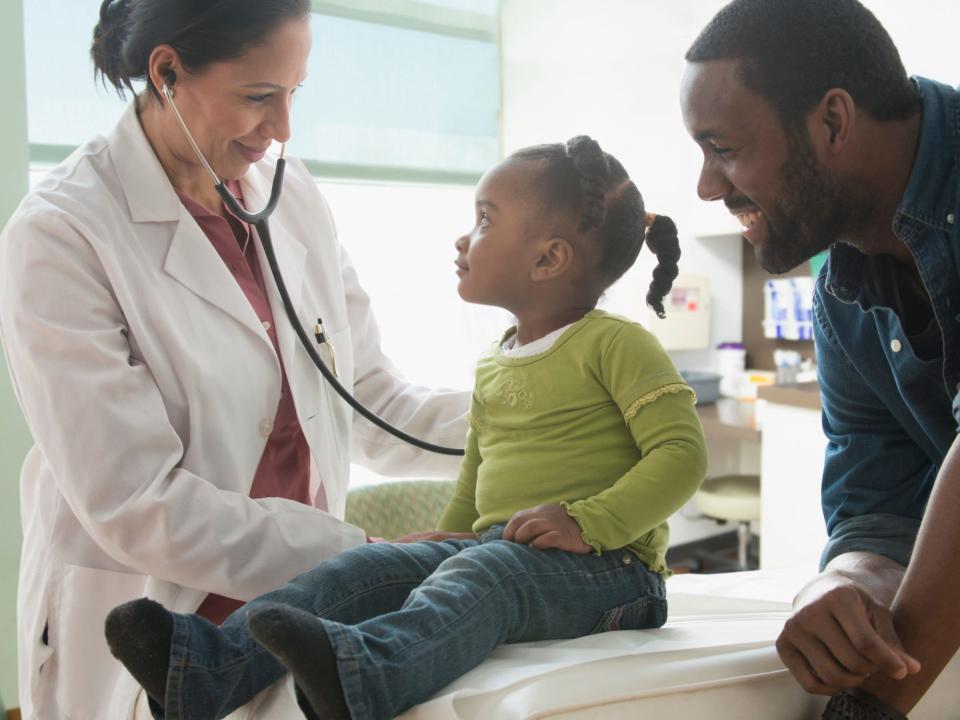 Doctor with a patient and parent