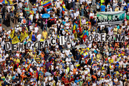 Opposition supporters take part in a rally against Venezuelan President Nicolas Maduro's government in Caracas, Venezuela February 2, 2019. REUTERS/Adriana Loureiro