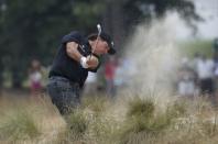 Phil Mickelson of the U.S. hits a shot from the rough on the 12th hole during the first round of the U.S. Open Championship golf tournament in Pinehurst, North Carolina, June 12, 2014. REUTERS/Mike Segar