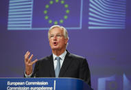 European Union chief Brexit negotiator Michel Barnier looks at his watch prior to speaking during a media conference at EU headquarters in Brussels, Thursday, Oct. 17, 2019. The European Union says Brexit negotiations are plowing on after intense talks in recent days, as EU leaders converge on Brussels for a key summit aimed at sealing a new divorce agreement. (AP Photo/Frank Augstein)