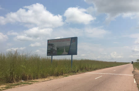 A signboard is seen along the road leading to the Bukanga Lonzo agro-industrial park in Bukanga-Lonzo, western Democratic Republic of Congo, April 27, 2018. REUTERS/Patient Ligodi