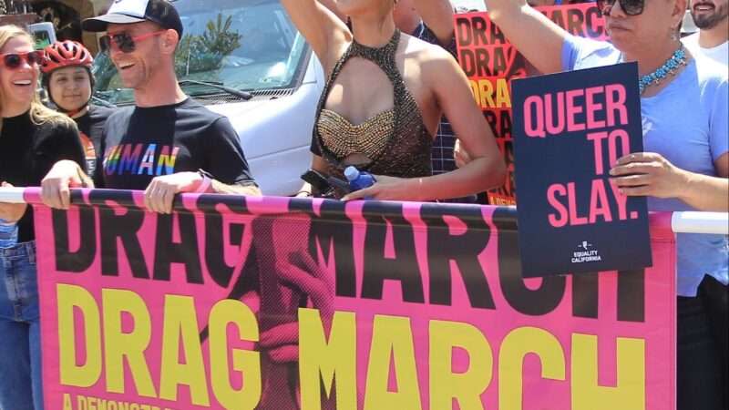 Protesters carrying a banner that reads "drag march"