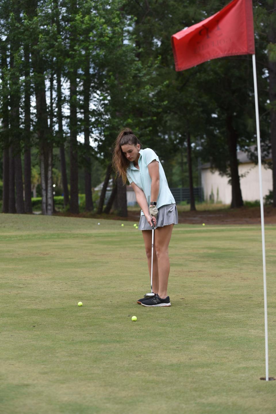 Effingham County High School freshman Marlina Wilson works on her putting late at golf practice Thursday, May 12, 2022, at Lost Plantation in Rincon.