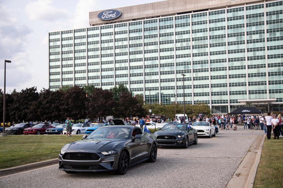 The first wave of more than 1,000 Ford Mustang cars leaves the Ford Motor Co. World Headquarters in Dearborn, Mich., for downtown Detroit ahead of the 2024 Mustang reveal on Sept. 14, 2022.