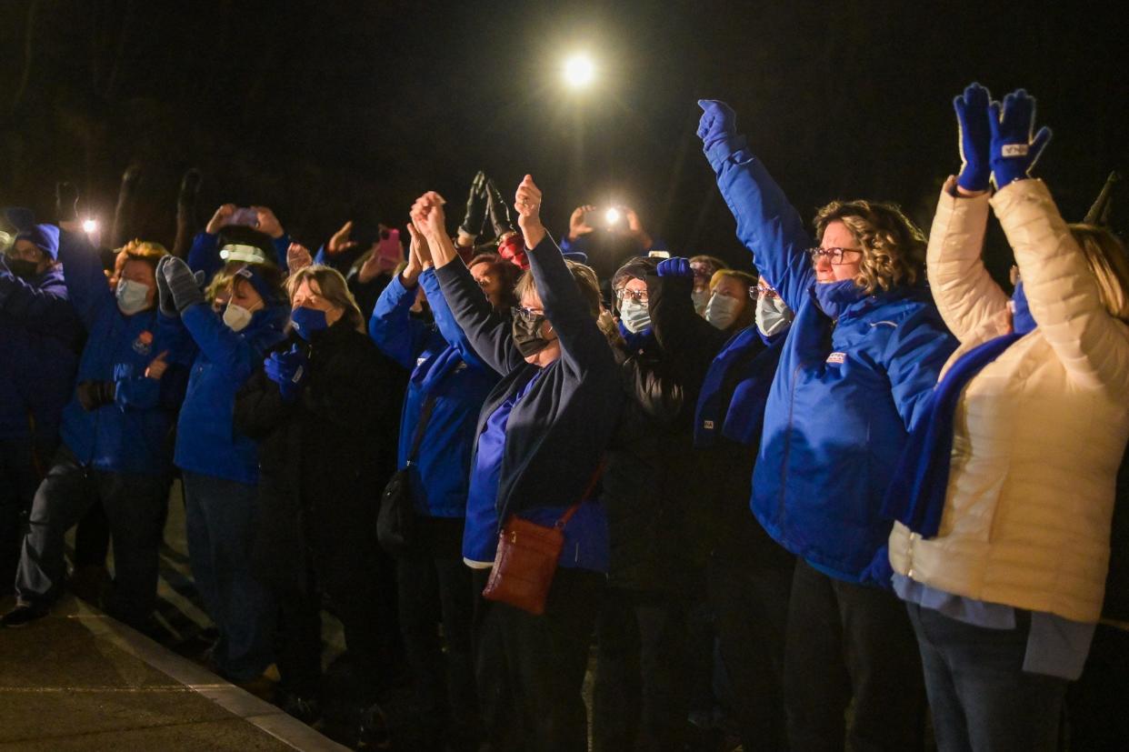 St. Vincent Hospital nurses celebrate Monday night after the vote that ended the strike.