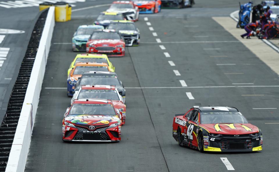 Kyle Larson (42) heads to his pit as the field comes down pit road during a NASCAR Cup Series auto race, Sunday, April 15, 2018, in Bristol, Tenn. (AP Photo/Wade Payne)