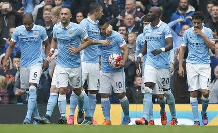 Football - Manchester City v Newcastle United - Barclays Premier League - Etihad Stadium - 3/10/15 Sergio Aguero celebrates with team mates after scoring the third goal for Manchester City and completing his hat trick Reuters / Andrew Yates Livepic EDITORIAL USE ONLY. No use with unauthorized audio, video, data, fixture lists, club/league logos or "live" services. Online in-match use limited to 45 images, no video emulation. No use in betting, games or single club/league/player publications. Please contact your account representative for further details.