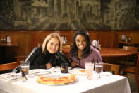 <p>Yahoo Global News Anchor Katie Couric poses for a photo with Olympic gold medalist Simone Biles after an interview at John’s Pizzeria in New York City on Nov. 18. (Gordon Donovan/Yahoo News) </p>