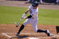 New York Yankees' Brett Gardner (11) hits a grand slam off Philadelphia Phillies starting pitcher Zack Wheeler during the second inning of a spring training exhibition baseball game at George M. Steinbrenner Field in Tampa, Fla., Sunday, March 7, 2021. (AP Photo/Gene J. Puskar)