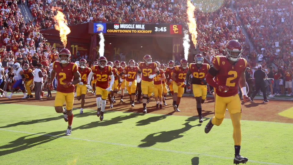 The USC Trojans run onto the field prior to the game against the San Jose State Spartans in August. - Katelyn Mulcahy/Getty Images