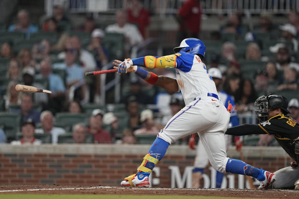 Atlanta Braves' Ronald Acuna Jr. (13) hits the ball and breaks a bat as he singles in the third inning of a baseball game against the Pittsburgh Pirates, Saturday, Sept. 9, 2023, in Atlanta. (AP Photo/Brynn Anderson)