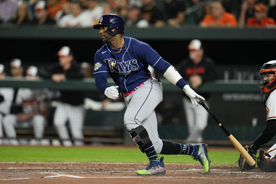 Tampa Bay Rays' Yandy Diaz follows through on a swing as he collects a single against the Baltimore Orioles in the third inning of a baseball game, Thursday, Sept. 14, 2023, in Baltimore. (AP Photo/Julio Cortez)