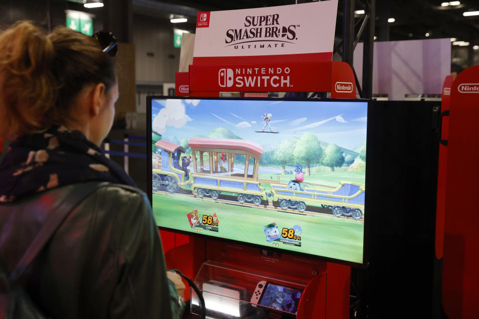 PARIS, FRANCE - NOVEMBER 01: A gamer plays the video game 'Super Smash Bros. Ultimate' developed by Sora Ltd. and Bandai Namco and edited by Nintendo on a Nintendo Switch console during Paris Games Week 2022 at Parc des Expositions Porte de Versailles on November 01, 2022 in Paris, France. After two years of absence linked to the Covid-19 pandemic, Paris Games Week is making a comeback in Paris. The event celebrating video games and esports will be held from November 2 to 6, 2022. (Photo by Chesnot/Getty Images)