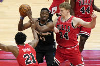 Milwaukee Bucks forward Thanasis Antetokounmpo, center, looks to pass as Chicago Bulls defenders Thaddeus Young, left, and Lauri Markkanen, right, guard during the first half of an NBA basketball game in Chicago, Sunday, May 16, 2021. (AP Photo/Nam Y. Huh)