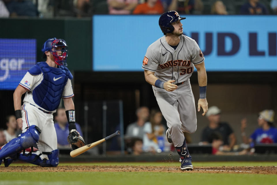 Houston Astros' Kyle Tucker (30) watches his two-run home run next to Texas Rangers catcher Sam Huff during the eighth inning of a baseball game in Arlington, Texas, Tuesday, June 14, 2022. (AP Photo/LM Otero)