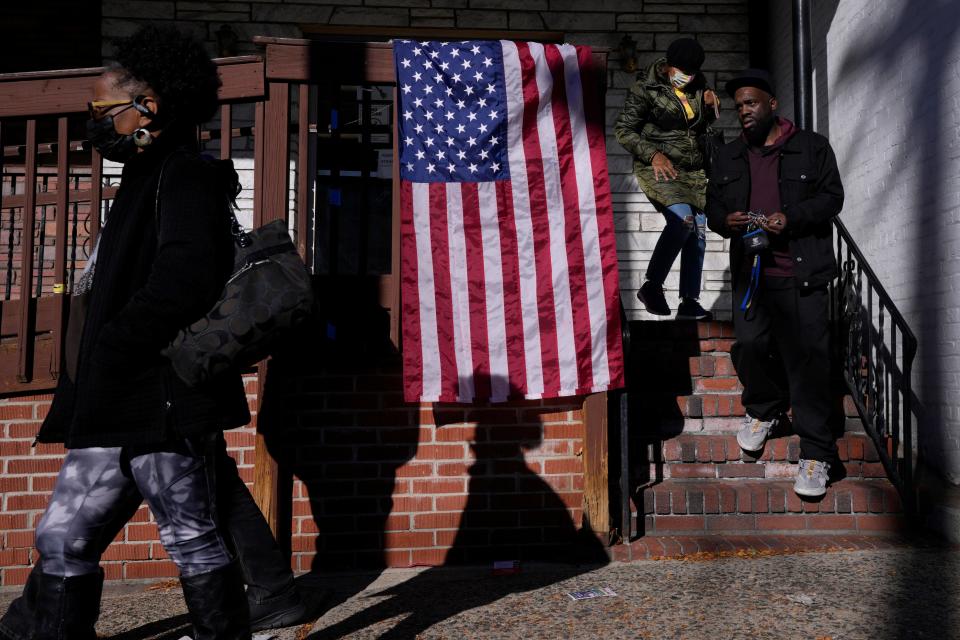 People walk out of a polling location on 5th Ave. in Paterson.  Tuesday, November 8, 2022