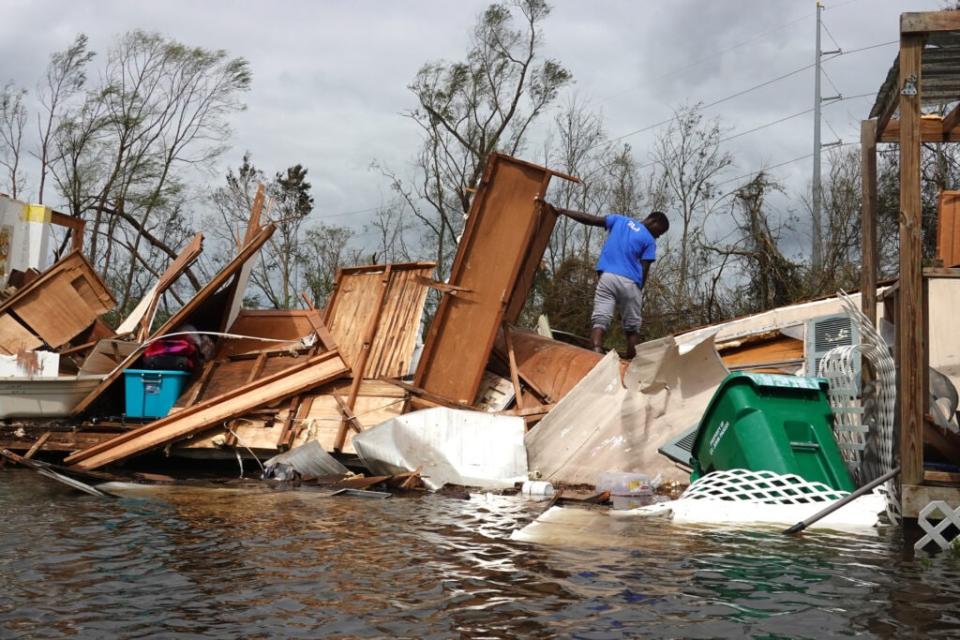 Alonzo Lewis rescues items from his mother’s home after it was destroyed by Hurricane Ida on August 30, 2021 in Laplace, Louisiana. Ida made landfall August 29 as a category 4 storm southwest of New Orleans. (Photo by Scott Olson/Getty Images)