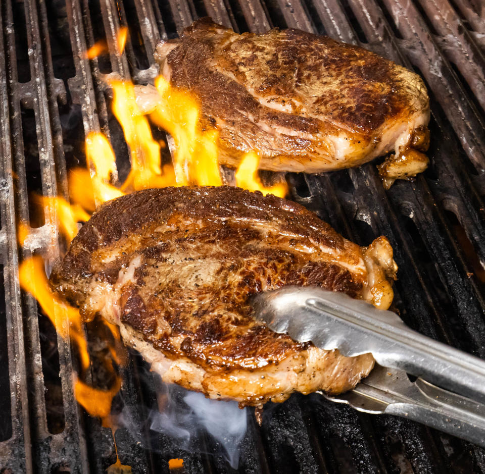 A ribeye steak on the grill at Stirrups.