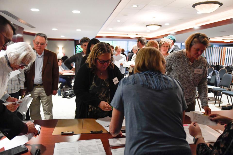 Community members participate in a reentry simulation at Greenville’s First Baptist Church on Thursday, April 27, 2023. The simulation is held to show the realities of the challenges people face after leaving prison.