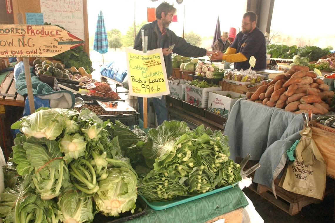 Duncan McMillan at the NC Farmers Market on New Year’s Day in 2007 to pick up about five pounds of fresh collards to go along with his black-eyed peas for dinner.