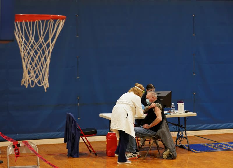 FILE PHOTO: COVID-19 vaccines are administered in Martinsburg, West Virginia