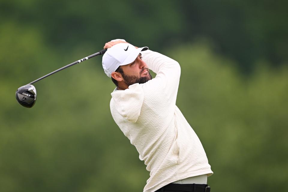 Scottie Scheffler plays a shot from the first tee during a practice session Wednesday at Valhalla Golf Club ahead of the 2024 PGA Championship.