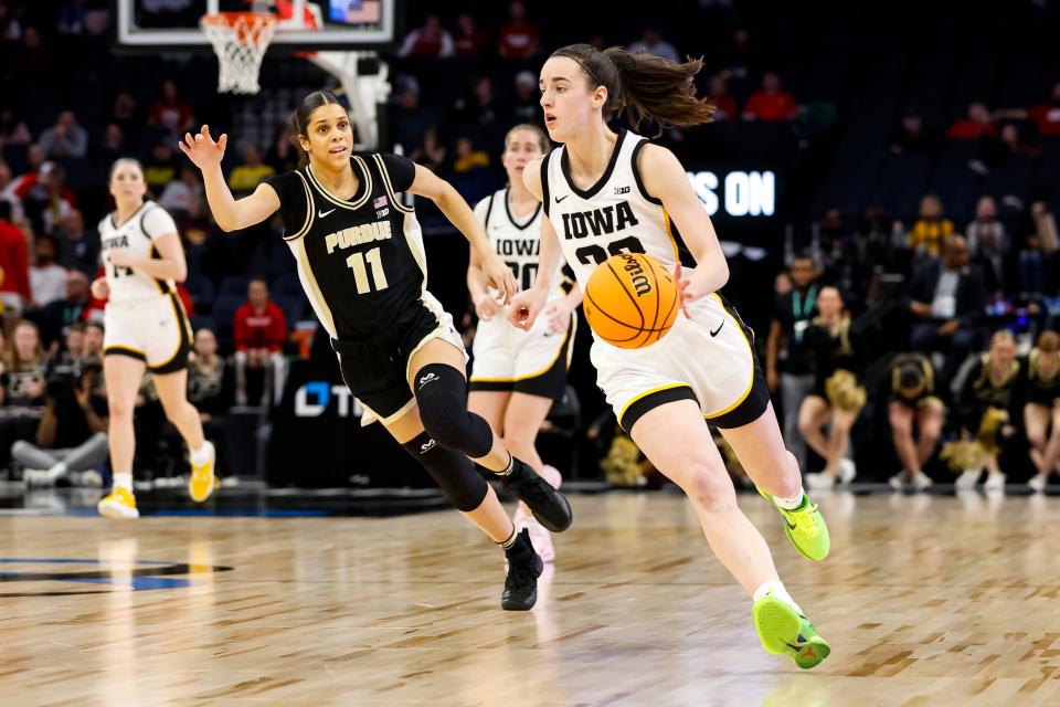 Iowa's Caitlin Clark dribbles the ball against Purdue in the second half of the game in the quarterfinals of the Big Ten Women's Basketball Tournament at Target Center on March 3, 2023 in Minneapolis, Minnesota. The Hawkeyes defeated the Boilermakers, 69-57.