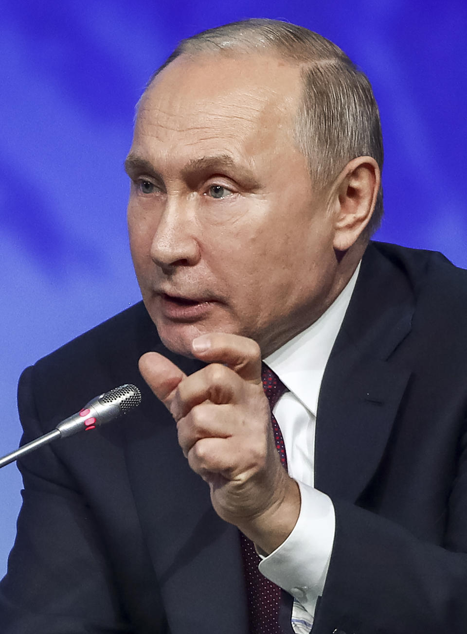 Russian President Vladimir Putin gestures during a plenary session of the International Arctic Forum in St. Petersburg, Russia, Tuesday, April 9, 2019. (Valery Sharifulin/TASS News Agency Pool Photo via AP)