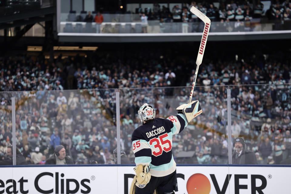Seattle Kraken goaltender Joey Daccord circles the ice acknowledging the crowd after a win over the Vegas Golden Knights in an NHL Winter Classic hockey game, Monday, Jan. 1, 2024, in Seattle. (AP Photo/John Froschauer)