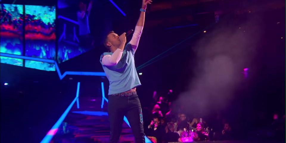 chris martin performing on stage