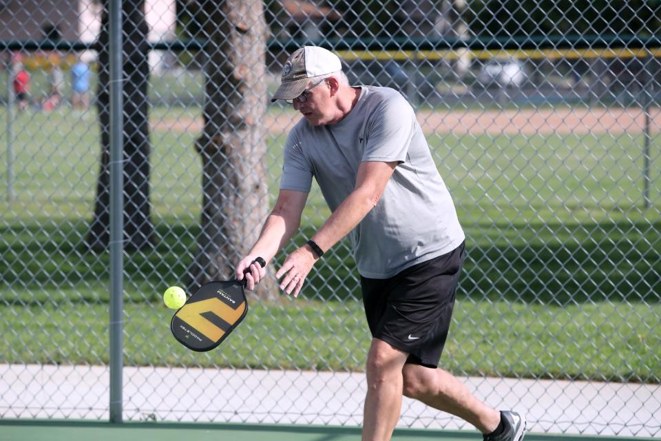 Brian Schumacher serves during a pickleball game at Manor Park on June 30.