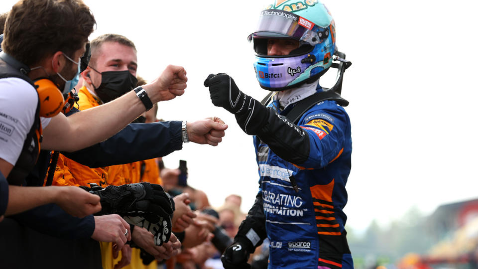 Sixth placed Daniel Ricciardo celebrates in parc ferme with McLaren team members after the F1 Grand Prix of Emilia Romagna. (Photo by Bryn Lennon/Getty Images)