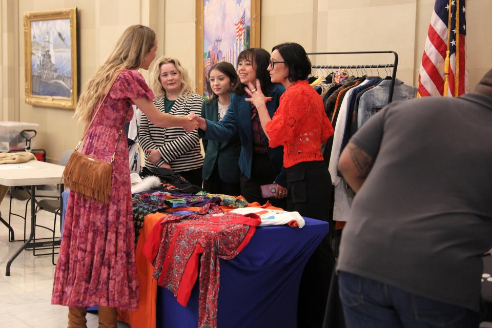 People stand at a booth on March 25 during Film and Music Day at the Capitol in Oklahoma City.