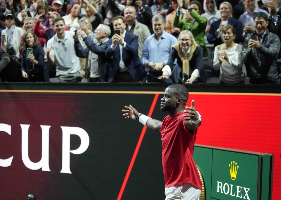 Team World's Frances Tiafoe celebrates after winning the singles tennis match against Team Europe's Stefanos Tsitsipas on the third day of the Laver Cup tennis tournament at the O2 arena in London, Sunday, Sept. 25, 2022. (AP Photo/Kin Cheung)