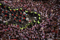 <p>A municipal band is surrounded by revelers after the launch of the <em>chupinazo</em> rocket to celebrate the official opening of the 2017 San Fermín Fiesta. (Photo: Alvaro Barrientos/AP) </p>