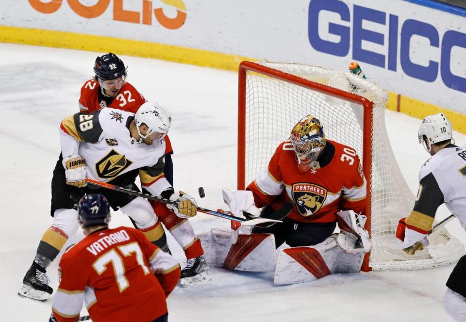 Florida Panthers goaltender Spencer Knight (30) Panthers defenseman Lucas Carlsson (32) and Panthers center Frank Vatrano (77) defends the goal from Vegas Golden Knights left wing William Carrier (28) during the third period of an NHL game at the FLA Live Arena on Thursday, January 27, 2022 in Sunrise, Fl.