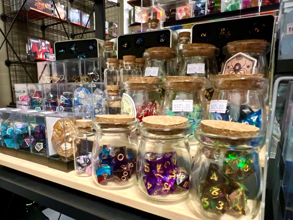 Game dice and other playable pieces are on display at Muletown Hobbies and Games, which recently opened at the Columbia Arts Building located in the Columbia Arts District.