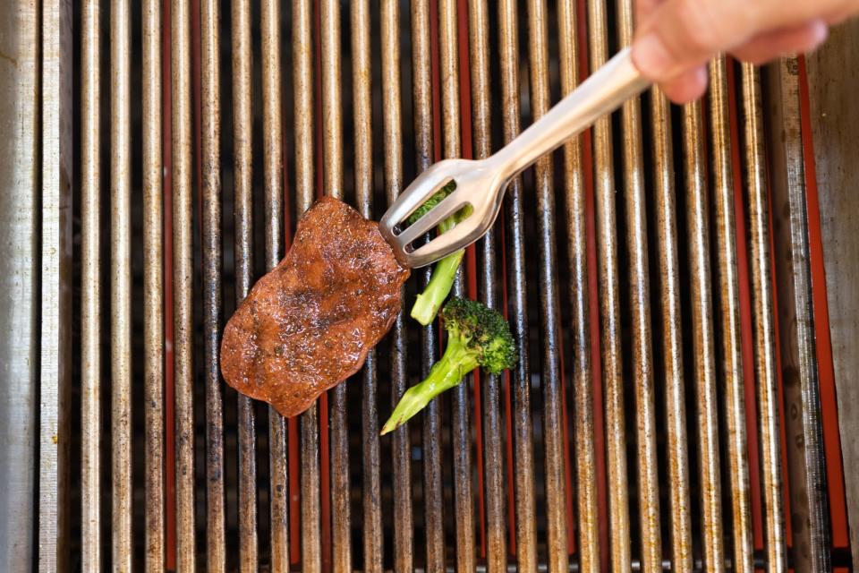 A chef grills a piece of cultivated thin-cut steak in the Aleph Farms Ltd. development kitchen in Rehovot, Israel, on Sunday, Nov. 27, 2022. The UN predicted last year that with the world's population expected to climb by 11% in the coming decade, meat consumption would rise by an even greater 14%.