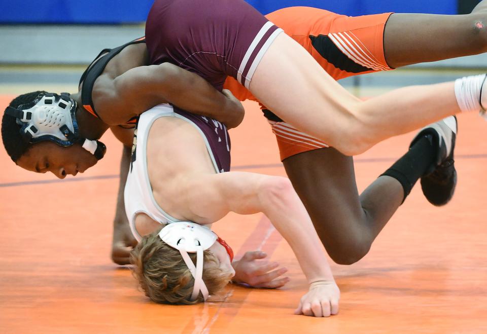 Cathedral Prep's Amir Johnson, top, wrestles St. Joe's Austin Zimmerman in a 114-pound bout during the Rambler Duals team tournament inside Prep's Hagerty Family Events Center on Saturday. Prep wrestles Meadville in a Region 5 match Wednesday.