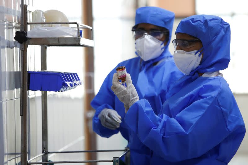 Medical staff with protective clothing are seen inside a ward specialised in receiving any person who may have been infected with coronavirus, at the Rajiv Ghandhi Government General hospital in Chennai