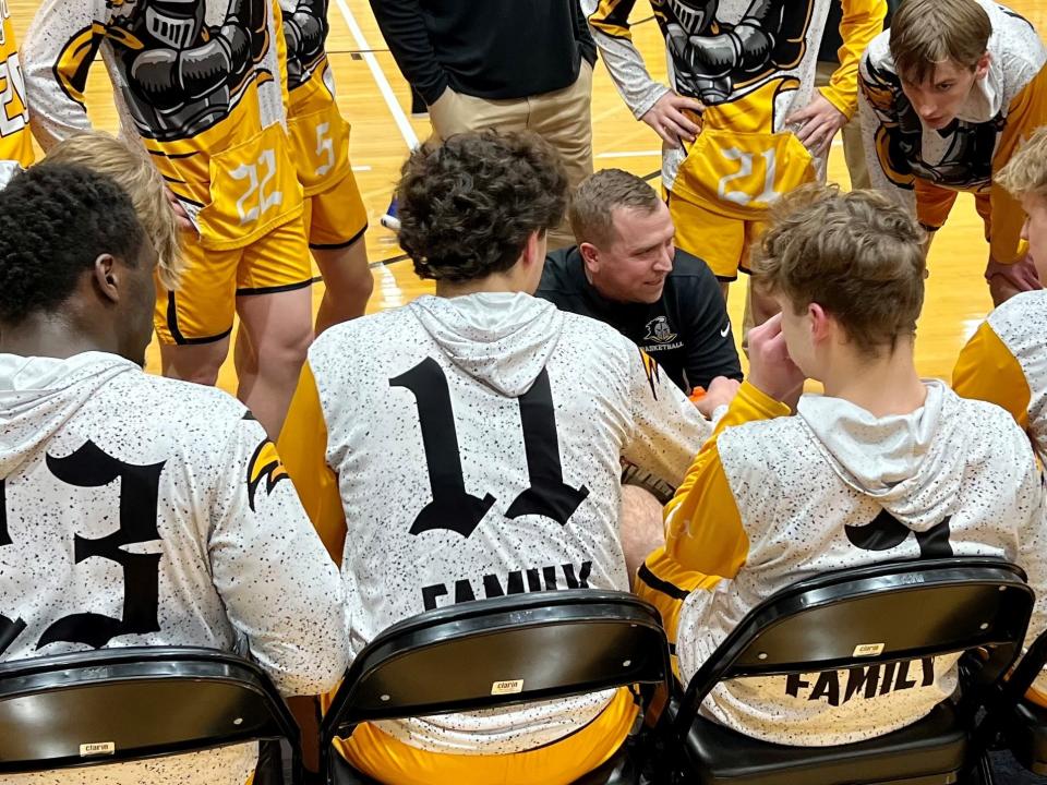 Northmor boys basketball coach Blade Tackett talks to his team before the Division IV district championship game at Ohio Dominican University's Alumni Hall Friday night against Patriot Prep.
