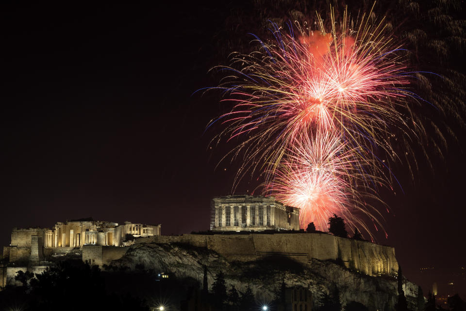 Fireworks explode over the ancient Parthenon temple at the Acropolis hill during New Year celebrations in Athens, Greece, Sunday, Jan. 1, 2023. (AP Photo/Yorgos Karahalis)