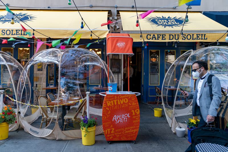 FILE PHOTO: Bubble tents are set up outside Cafe Du Soliel following the outbreak of the coronavirus disease (COVID-19) in the Manhattan borough of New York City