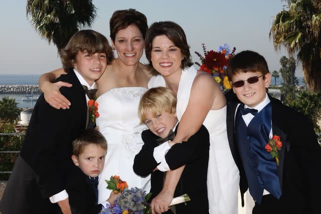 <p>Courtesy of Congresswoman Angie Craig's Office</p> Angie Craig (right) and wife Cheryl Greene pose with their children at their 2008 wedding