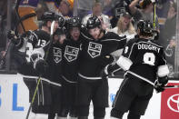 Los Angeles Kings right wing Viktor Arvidsson, second from left, celebrates with teammates after scoring during the first period of an NHL hockey game against the Calgary Flames, Monday, March 20, 2023, in Los Angeles. (AP Photo/Marcio Jose Sanchez)